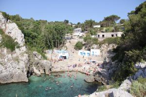a group of people in the water at a beach at Borgo Antico in Diso