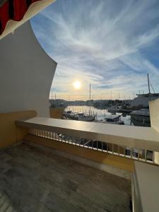 a view of a marina from the balcony of a building at La Marina de Lairan 2 chambres terrasse vue Port de Plaisance in Le Grau-du-Roi