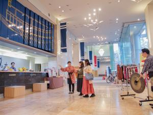 a group of people standing in a shopping mall at 汐の丸 in Imabari +154 photos