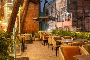 a row of tables and chairs in a restaurant at Hotel Kailash Kutee in Kathmandu