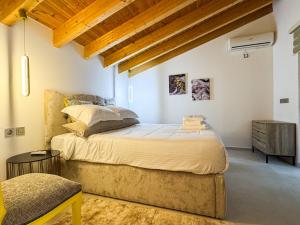 a bedroom with a large bed in a room at SAmalia Apartments Nafplio in Nafplio