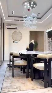 a dining room with a table and chairs at Nimpat apartment in Lagos