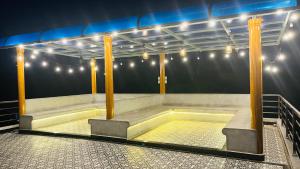 a stage with columns and lights in a arena at Eevara Beach By Shore in Kaup