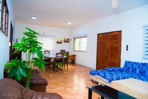 a living room with a couch and a table at Guesthouse Chez Marco in Cotonou