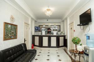 a living room with a couch and a bar at Таугуль in Zhezdi