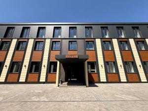 a large building with a doorway in front of it at Готель Гоголь in Poltava