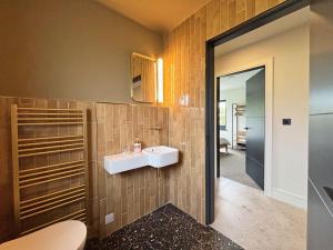 a bathroom with a sink and a mirror at Cottage 505 - Roundstone in Roundstone +31 photos