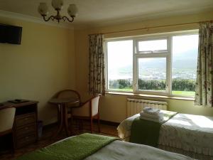 Postel nebo postele na pokoji v ubytování Achill West Coast House