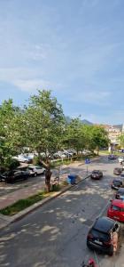 a street with cars parked in a parking lot at The Pillows Kalamata in Kalamata