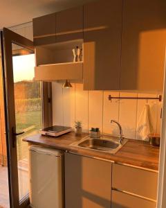 a kitchen counter with a sink and a window at Enjoy the Silence in Marmaris