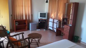 TV a/nebo společenská místnost v ubytování KANDY Holiday Residence