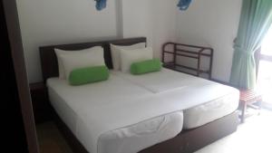 Postel nebo postele na pokoji v ubytování KANDY Holiday Residence