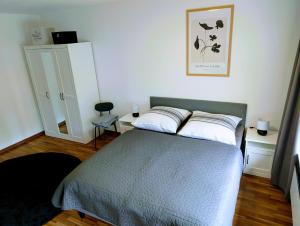 a bedroom with a bed with two pillows on it at Apartment37671 in Höxter