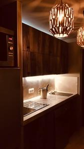 a kitchen with a stove top with a pot on it at PRIVATE ROOM & SPA avec Jacuzzi privatif in Lorgues
