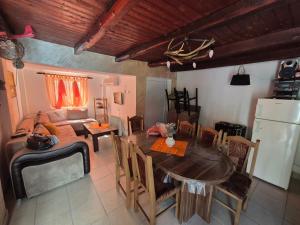 a living room with a table and a couch at Vikendica Bagremov hlad Apatin in Apatin