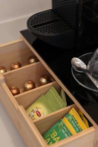 a wooden drawer filled with different types of food at Anel Rooms in Himare +43 photos