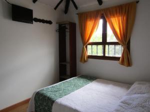 Una cama o camas en una habitación de La Casona Nuñez