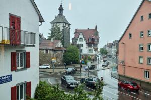 a city street with cars on a rainy day at seeglueck Altstadt Urban in Konstanz
