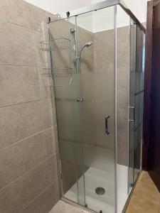 a shower with a glass door in a bathroom at Casa vacanze Pezzoli in Rovato