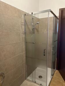 a shower with a glass door in a bathroom at Casa vacanze Pezzoli in Rovato