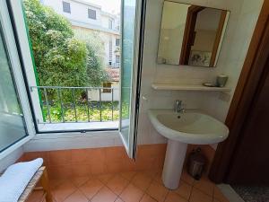 a bathroom with a sink and a window at Hotel Villa Bianca in Laigueglia +52 photos