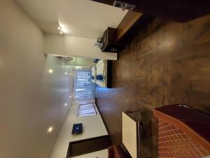 an overhead view of a room with a kitchen and a room at Palette - Silver Leaf in Vapi