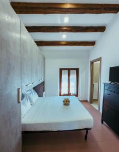 a bedroom with a large bed with a bowl on it at Gold Palace ***** in Ferrara