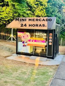 a mini mercacco horoscopes shop with a sign on it at Cavalheris House - Rota das Vinícolas in Espirito Santo Do Pinhal