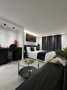 a hotel room with a bed and a table at Urban Spaces Ibiza in Ibiza Town +19 photos