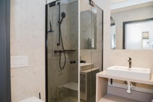 a bathroom with a shower and a sink at Fewo Mauterndorf in Mauterndorf