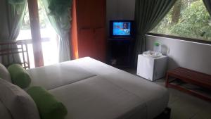 Postel nebo postele na pokoji v ubytování KANDY Holiday Residence