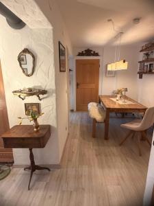 a living room with a table and a dining room at Apartment Ape Maja in Bad Wiessee