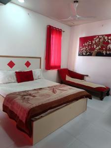 a bedroom with a bed and a red window at Jannat Villa by Book Ur Stay in Lonavala +36 photos