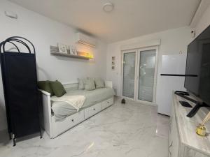 a bedroom with a bed and a television in it at Estudio Cuidad Quesada in Rojales