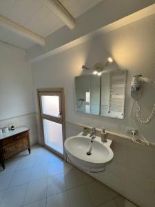 a bathroom with a sink and a mirror at Antico castello BeB in Altamura +15 photos