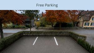 an empty parking lot in a park with trees at UNO Smart Soltau Wietzendorf in Soltau