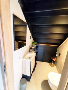 a bathroom with a toilet and a sink at Casa Eddy in Bale +21 photos