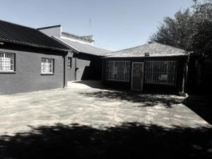 a black and white photo of a house at Fullmoon Homes 9A in Edenvale