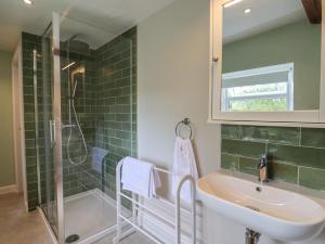 a bathroom with a sink and a shower at Harbins Farm in Sherborne +56 photos