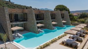 an image of a hotel with a swimming pool at Gialova Hills 8 in Gialova