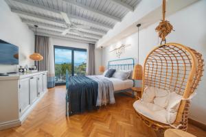 a bedroom with a bed and a chair in a room at Yacht Boheme Hotel-Boutique Class - Adults Only in Fethiye +61 photos
