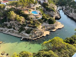 an aerial view of a river with a resort at Villa Forcat in Ciutadella