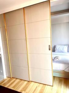 a bedroom with a closet with a bed at Coconut Suite Aonang in Ao Nang Beach