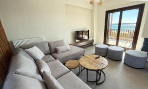 a living room with a couch and a table at Athos Villas in Ouranoupoli