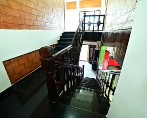 a view of a staircase in a building at Assraya stay in Kushālnagar