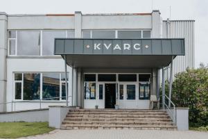 a building with a sign that reads kvarma at KVARC Hotel in Valmiermuiža