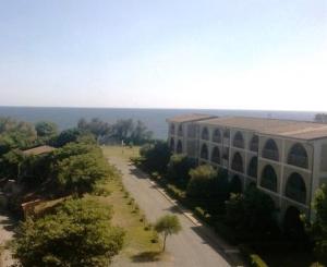 an aerial view of a building and a road at Cala Longa Poseidon Beach Resort in Casa dello Stumio +3 photos