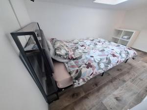 a small bedroom with a bed and a mirror at Mamma Lucia accommodation in Borno