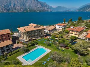 an aerial view of a resort with a swimming pool at Hotel Astoria - 3stelle S in Malcesine