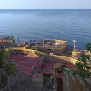 a view of the ocean from the top of a building at Cala Longa Poseidon Beach Resort in Casa dello Stumio